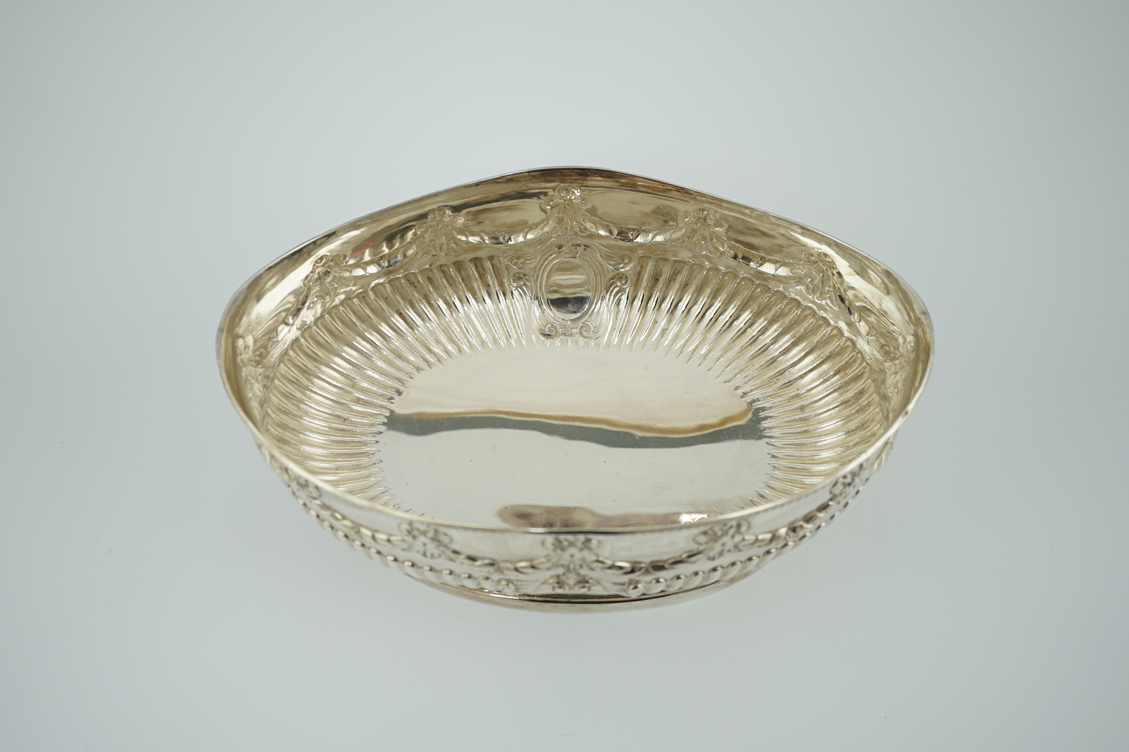 A late Victorian demi-fluted silver oval fruit bowl, by Martin, Hall & Co